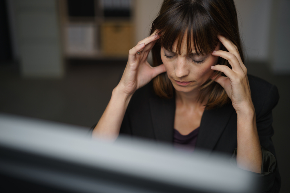 Businesswoman suffering from a migraine